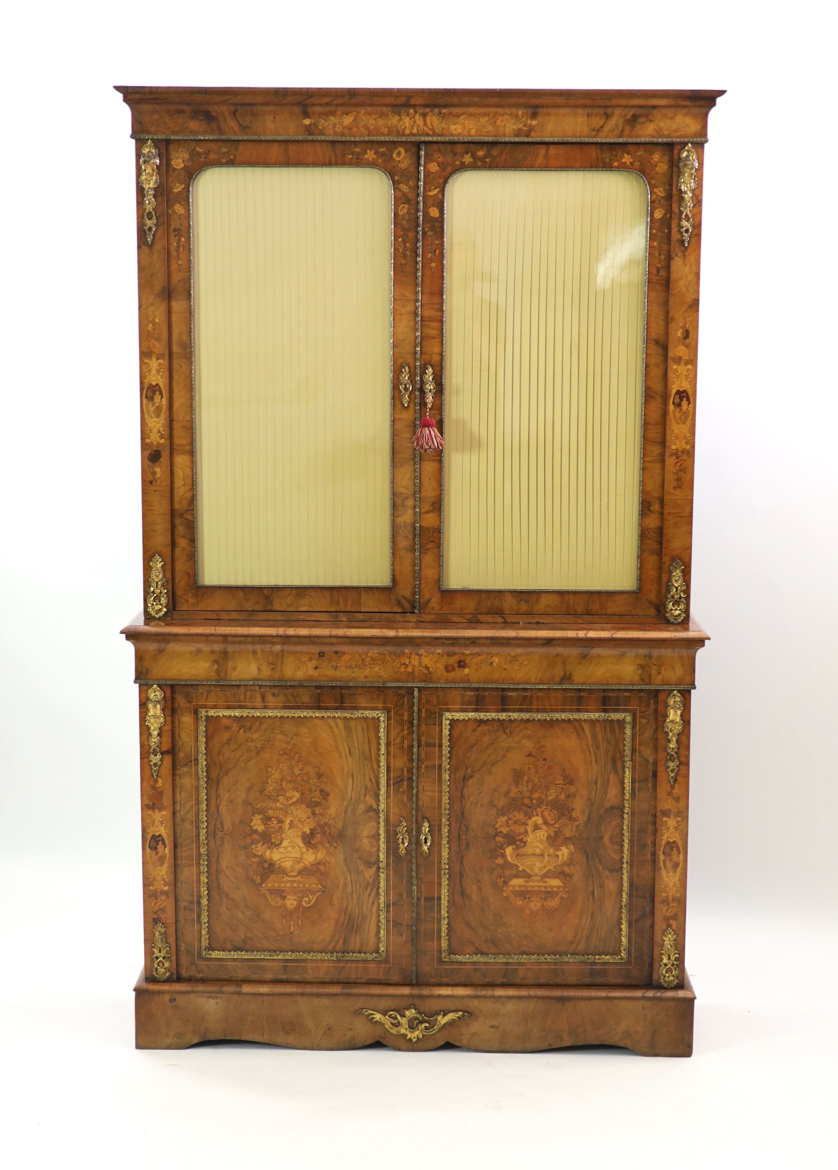 A Victorian ormolu mounted marquetry inlaid walnut bookcase, W.127cm D.40cm H.208cm